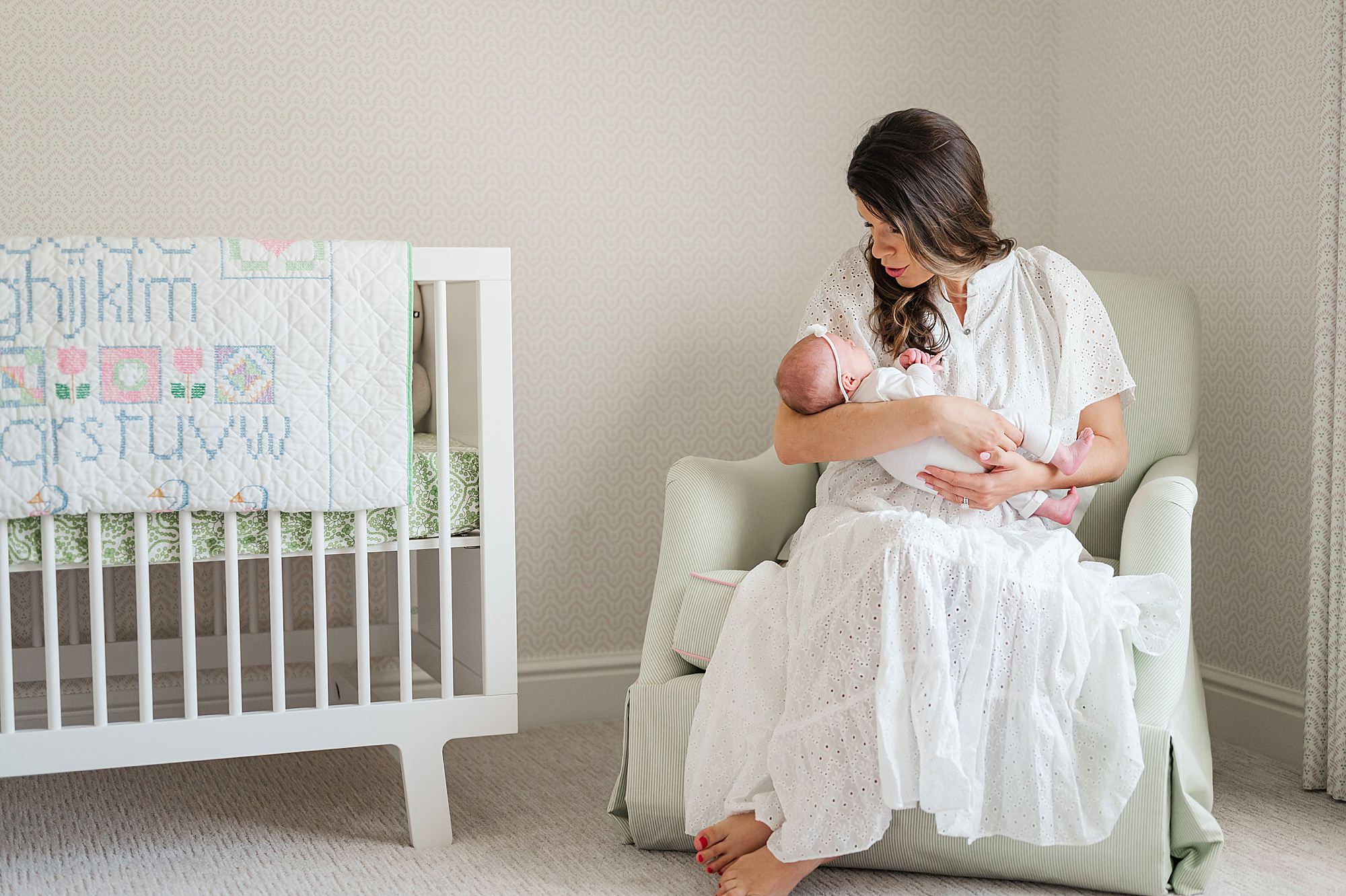 mom and baby in nursery photography • Lifestyle In Home Newborn Photos