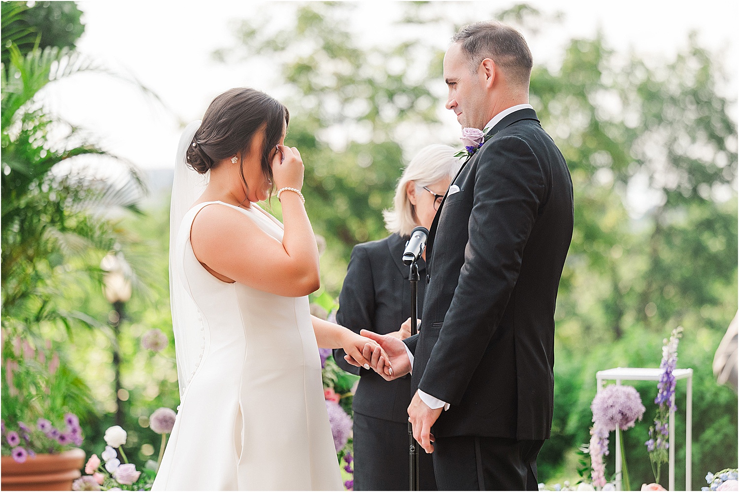 bride crying during wedding ceremony • Wild Weather - Love at a Phipps Conservatory Outdoor Garden Wedding