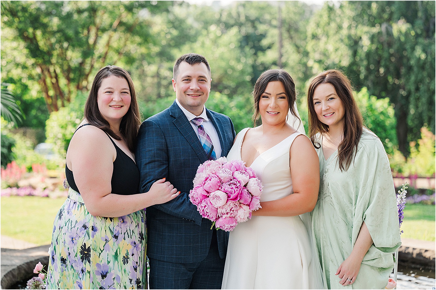 bride with siblings formal family photos • Wild Weather - Love at a Phipps Conservatory Outdoor Garden Wedding