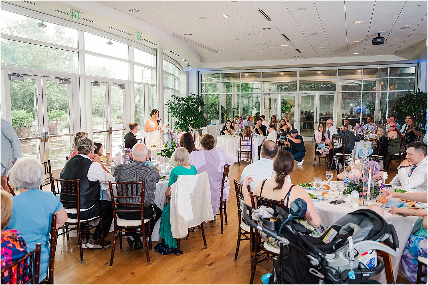 Bride giving speech at wedding in Sarris Special Events Halls Phipps Conservatory • Wild Weather - Love at a Phipps Conservatory Outdoor Garden Wedding